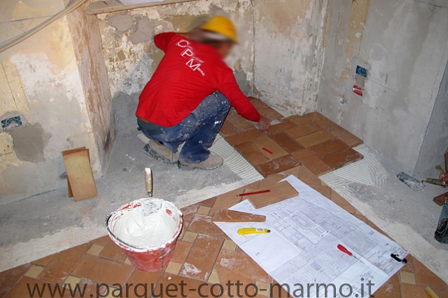 pavimenti in cotto;posa fascia laterale